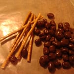 Gather enough pretzel sticks and chocolate covered raisins to create the eye stalks
