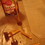 Break the pretzel stick from the sensor arm to form the blaster arm, also break the pretzel stick from the eye stalk to form the head lamps